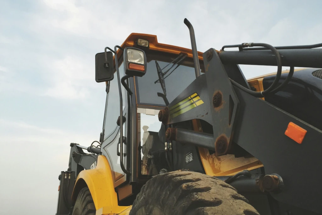 Row of industrial heavy equipment and commercial fleet vehicles available for operational leasing.
